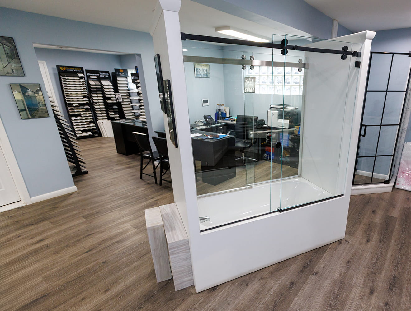 CA Glass showroom in New Jersey displaying frameless shower doors, glass hardware, and design options