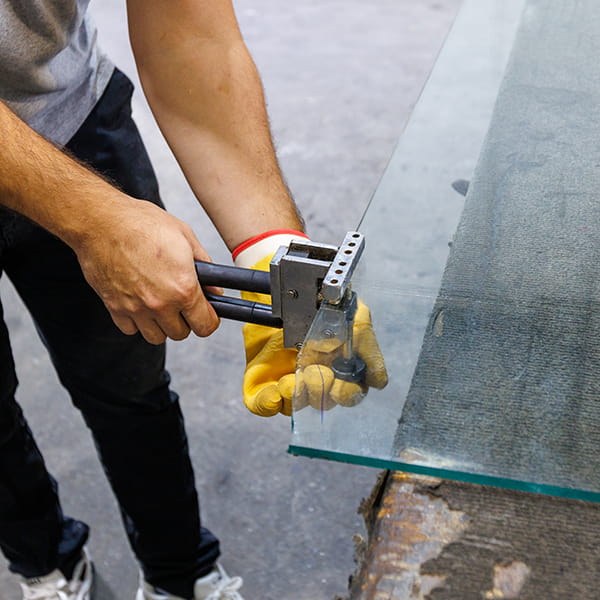 CA Glass fabricating frameless shower doors at New Jersey glass manufacturing facility