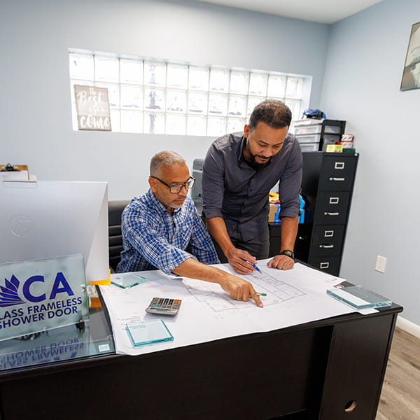 CA Glass designers preparing sketches and quotes for custom frameless glass projects in New Jersey