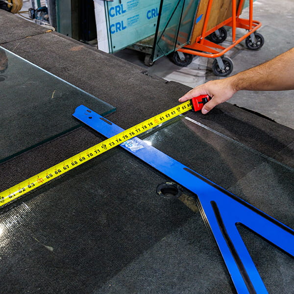 CA Glass team taking precise field measurements for frameless shower doors and custom glass installations in New Jersey