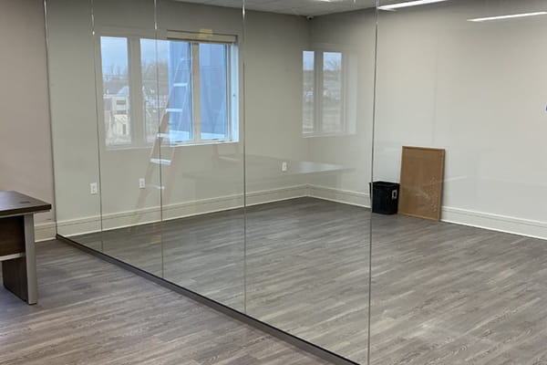 Sleek glass divider partitions optimizing office flow