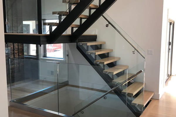 Shoe base handrail on glass railing design