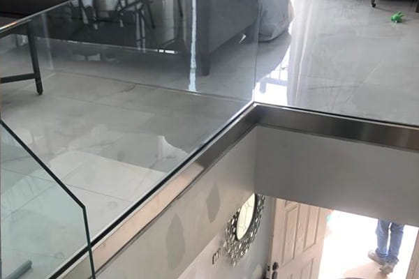 Shoe base staircase panel railing system