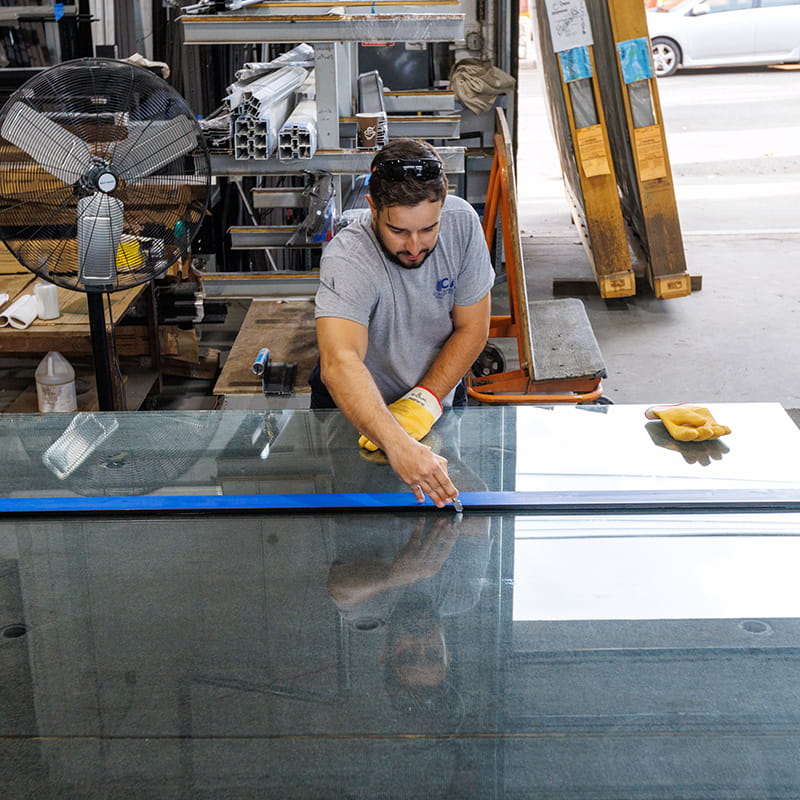 CA Glass team fabricating a custom frameless glass shower enclosure for a Summit, New Jersey home