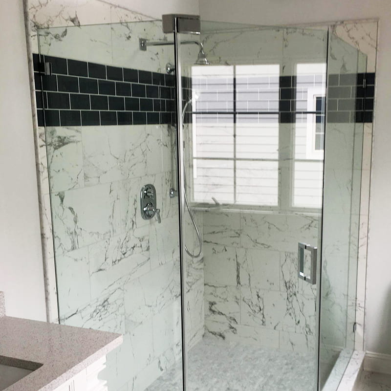 Neo-angle frameless shower door designed for corner bathrooms by CA Glass in New Jersey