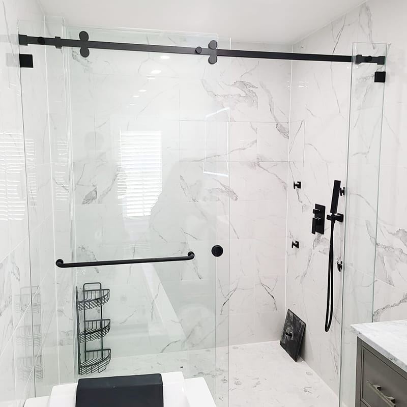 Frameless sliding glass shower doors with smooth bypass operation installed by CA Glass in New Jersey